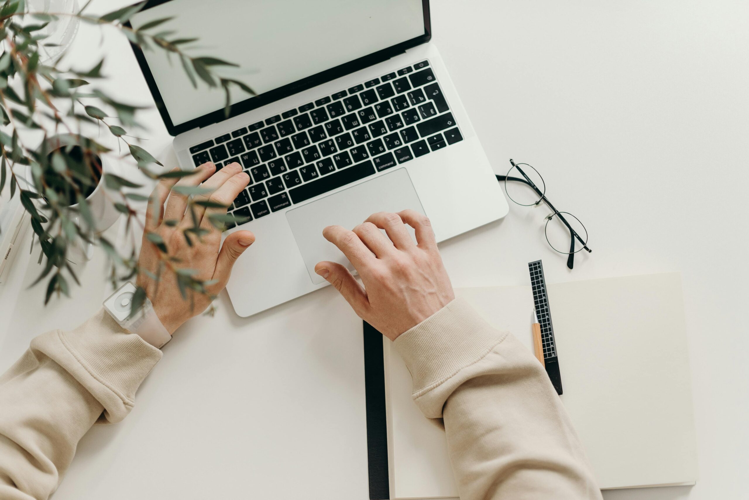 pexels-cottonbro-4065876-scaled.jpg Free An overhead view of a person working on a laptop in a minimalist home office setting. Stock Photo